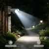 Lámpara de pared con sensor de movimiento alimentada por energía solar farola de seguridad con cámara tipo cebo brillo ajustable para exteriores jardín y entrada de coches 3
